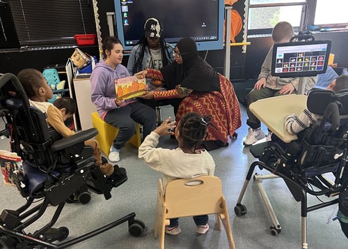Haley M. reads to Early Childhood students