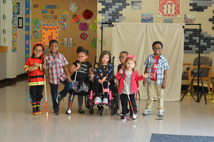 Group of young students stand together in a group