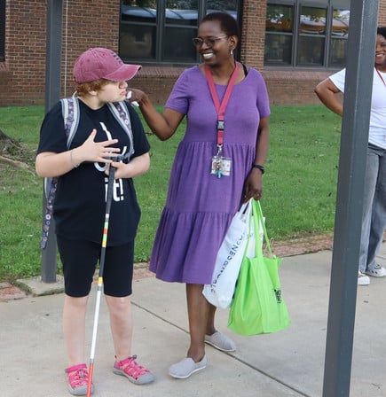STRIDE student Aeryn and her intervener Susan W. shares smiles