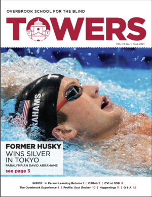 Male swimmer doing the backstroke in a pool.